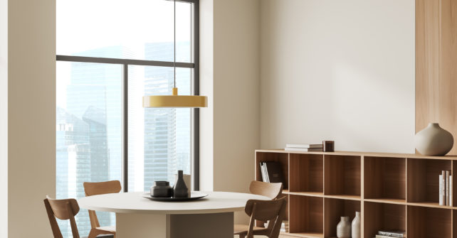 Beige living room interior with dining table and chairs, side view, shelf with decoration and books. Panoramic window on Singapore skyscrapers. Mockup empty wall. 3D rendering; Shutterstock ID 2209399731; purchase_order: nvt; job: Flooring online Laminaat Urban; client: ; other: